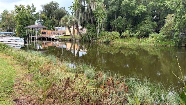 property view of water featuring a gazebo and a dock