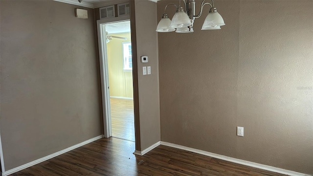 unfurnished dining area with dark hardwood / wood-style flooring and a chandelier