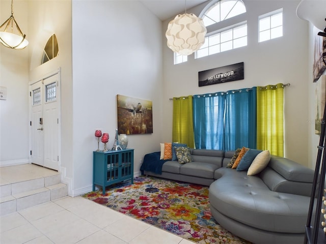 tiled living room featuring a high ceiling