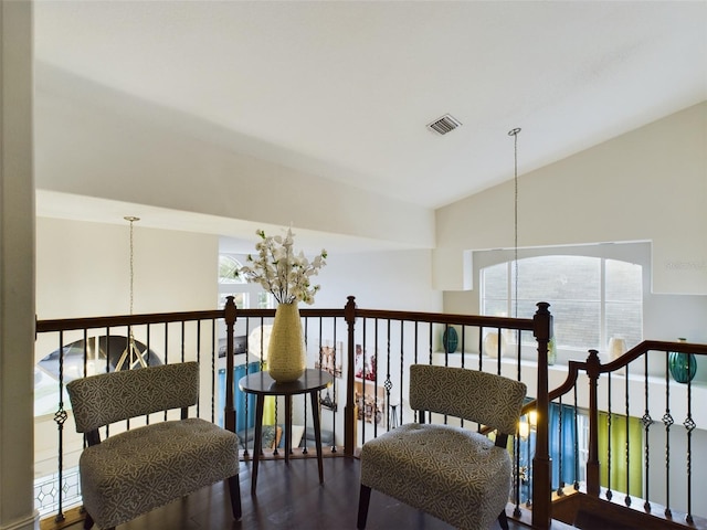 5219 Mystic Point Ct, Orlando, FL 32812 - interior space with visible vents, vaulted ceiling, a notable chandelier, and dark wood finished floors