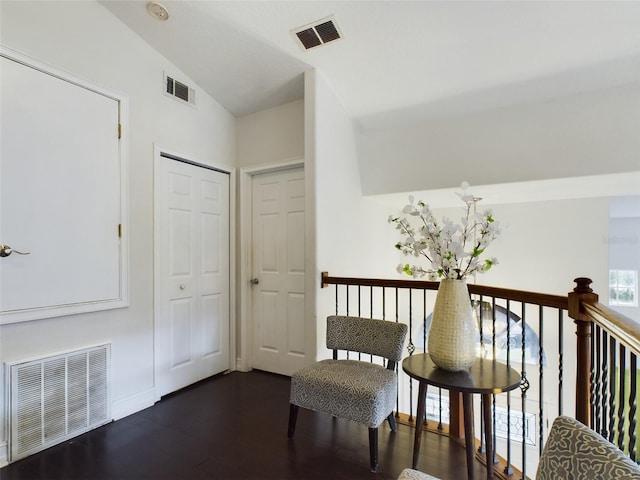 unfurnished room with lofted ceiling and dark hardwood / wood-style floors