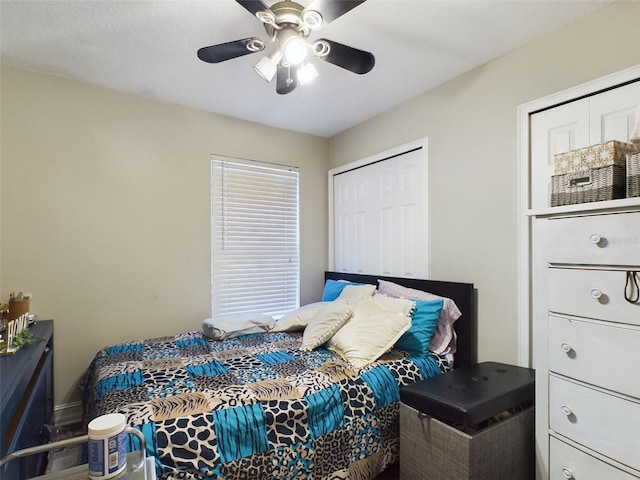 bedroom featuring ceiling fan and a closet