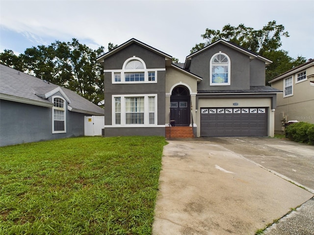 front of property with a front yard and a garage