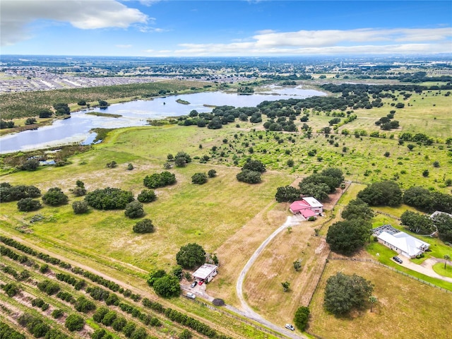 drone / aerial view with a rural view and a water view