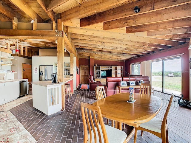 2741 Edwards Rd, Haines City, FL 33844 - dining room with beamed ceiling and brick patterned floors