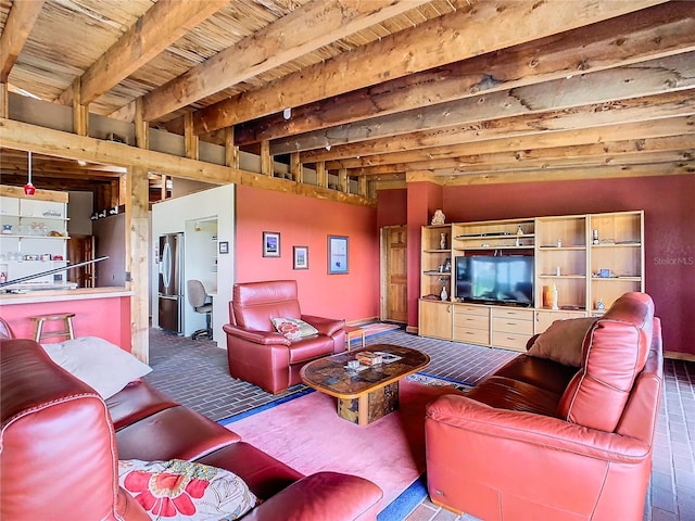 living room featuring wood ceiling, dark tile patterned floors, and beamed ceiling