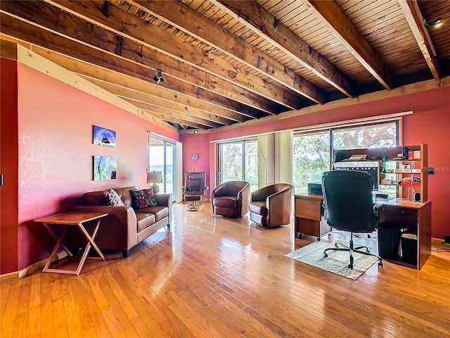 home office featuring beam ceiling, wooden ceiling, and hardwood / wood-style floors