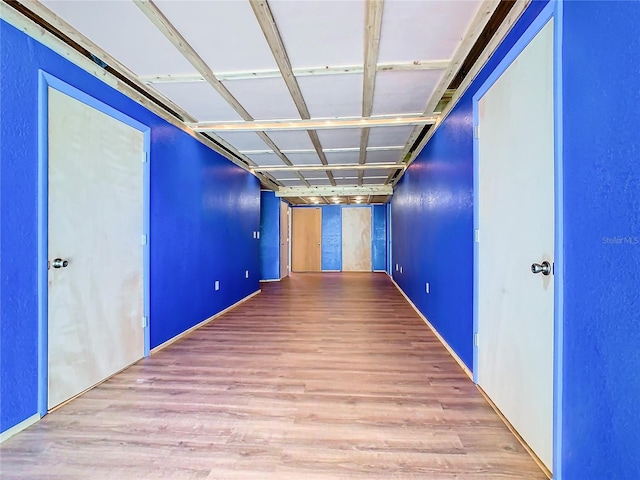 hallway featuring hardwood / wood-style floors