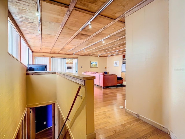 2741 Edwards Rd, Haines City, FL 33844 - hall featuring track lighting, light wood-style floors, wooden ceiling, and an upstairs landing