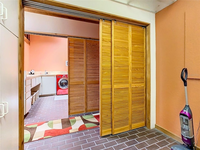 2741 Edwards Rd, Haines City, FL 33844 - bathroom with washer / dryer and brick flooring