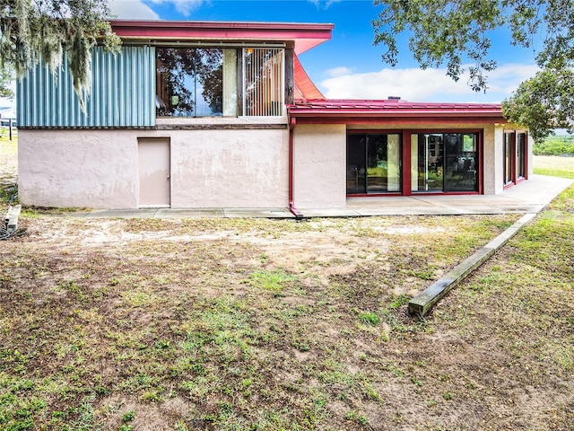 2741 Edwards Rd, Haines City, FL 33844 - rear view of property featuring stucco siding and a patio