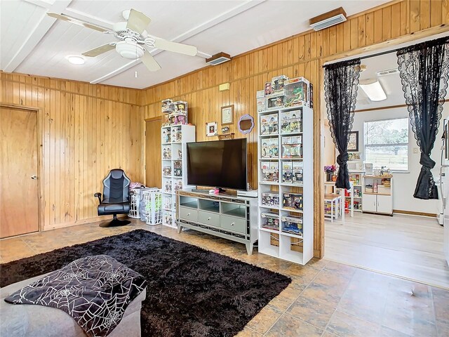 2741 Edwards Rd, Haines City, FL 33844 - living room featuring wood walls and ceiling fan