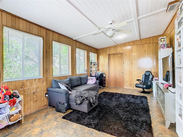 interior space with ceiling fan and vaulted ceiling