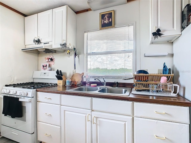 kitchen with sink, white cabinetry, and white gas range oven