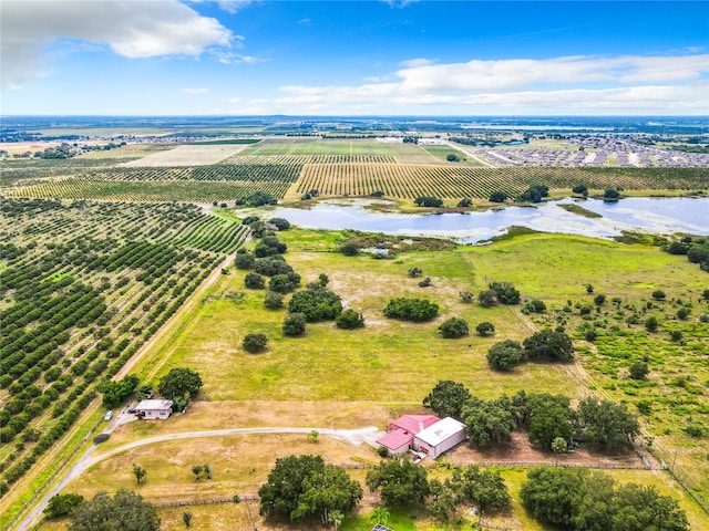 birds eye view of property with a rural view and a water view