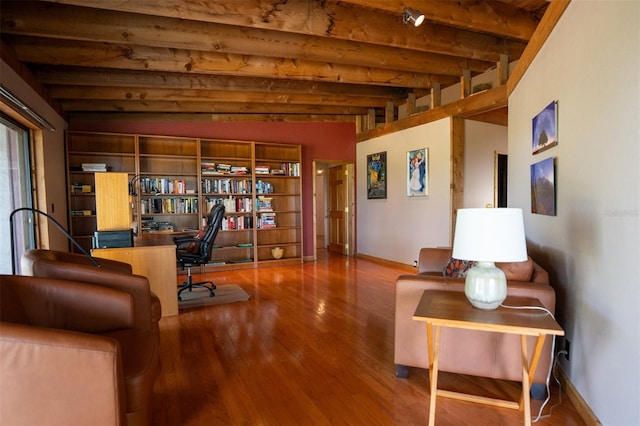 2741 Edwards Rd, Haines City, FL 33844 - living area featuring wood finished floors, beam ceiling, and a desk