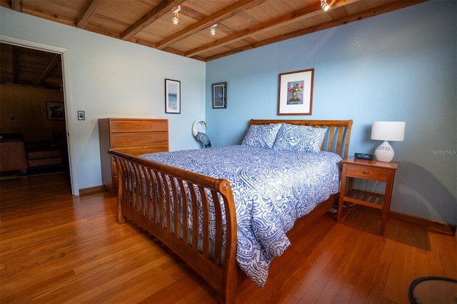 2741 Edwards Rd, Haines City, FL 33844 - bedroom featuring wood finished floors, a wooden ceiling with exposed beams, and rail lighting