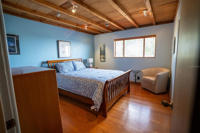 2741 Edwards Rd, Haines City, FL 33844 - bedroom featuring wood finished floors, track lighting, and a wooden ceiling with exposed beams