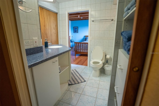 2741 Edwards Rd, Haines City, FL 33844 - bathroom with tile walls, tile patterned flooring, vanity, and ensuite bath