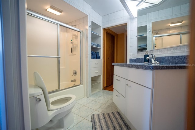 2741 Edwards Rd, Haines City, FL 33844 - full bath featuring tile patterned floors, vanity, enclosed tub / shower combo, and tasteful backsplash