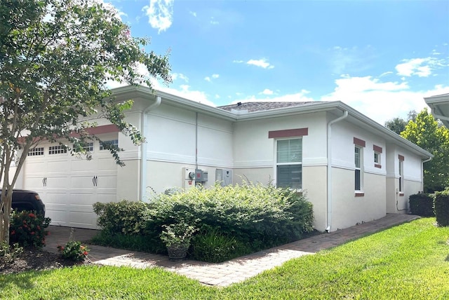 view of side of home with a garage