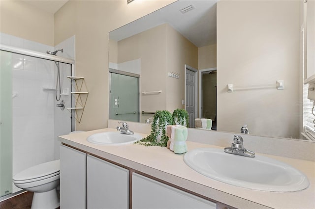 full bathroom with a shower stall, toilet, visible vents, and a sink
