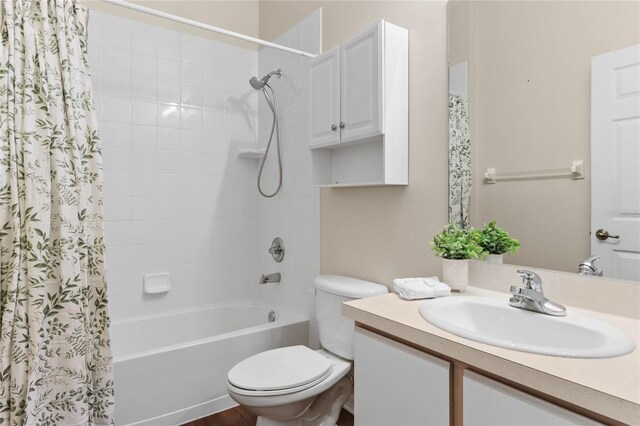 full bathroom featuring vanity, toilet, shower / bath combination with curtain, and hardwood / wood-style flooring