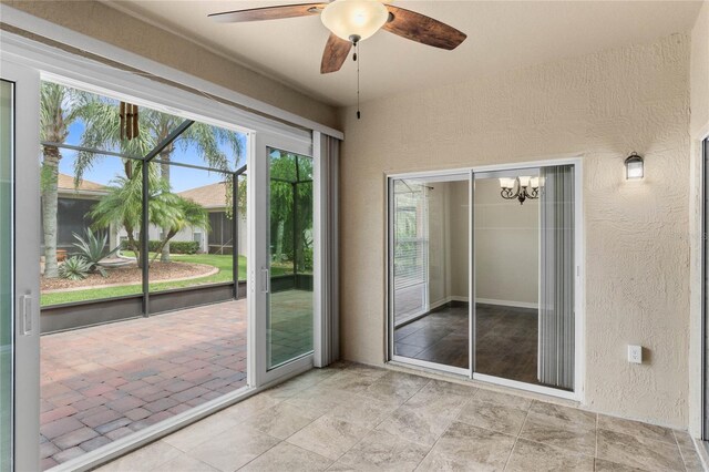 interior space with a wealth of natural light and ceiling fan