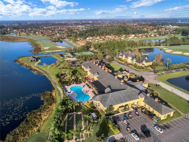 birds eye view of property with a water view