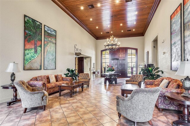 living room featuring a towering ceiling, an inviting chandelier, wooden ceiling, and light tile patterned flooring