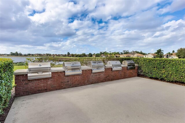 view of patio featuring a grill and an outdoor kitchen