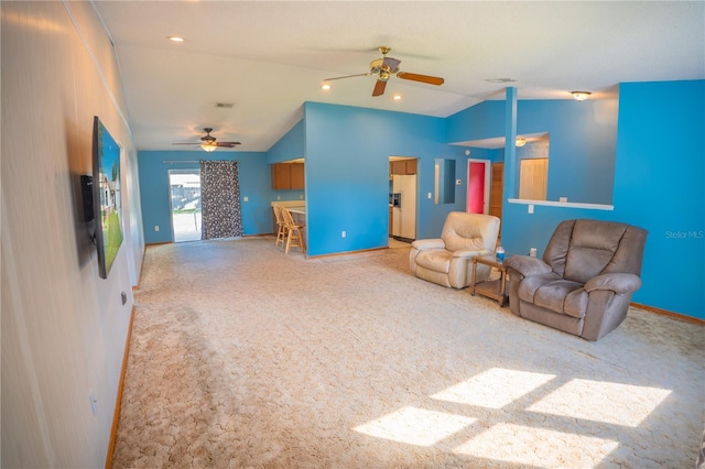 living room featuring ceiling fan, light carpet, and lofted ceiling