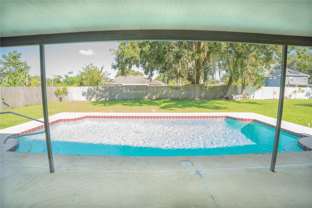 view of swimming pool with a patio area and a lawn