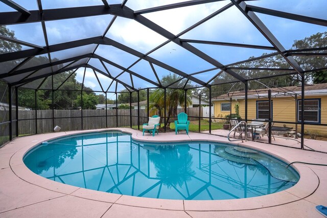 view of pool featuring a patio area and a lanai