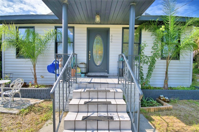 doorway to property featuring a porch