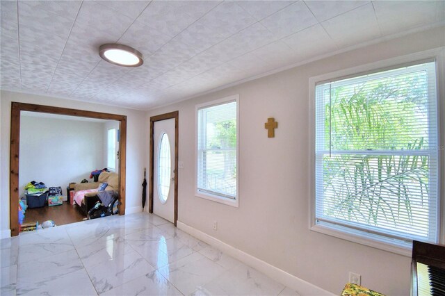 foyer entrance featuring light tile patterned floors