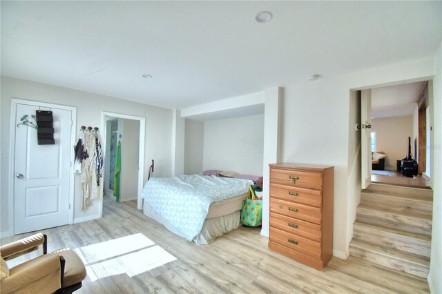 bedroom with light wood-type flooring