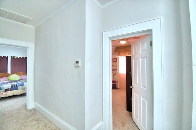 hallway with light colored carpet