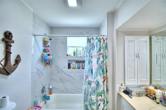 bathroom with shower / tub combo with curtain and ornamental molding