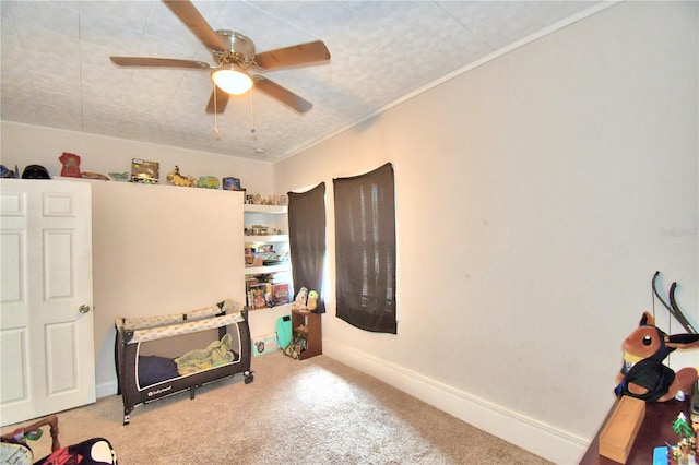 interior space featuring light colored carpet and ceiling fan