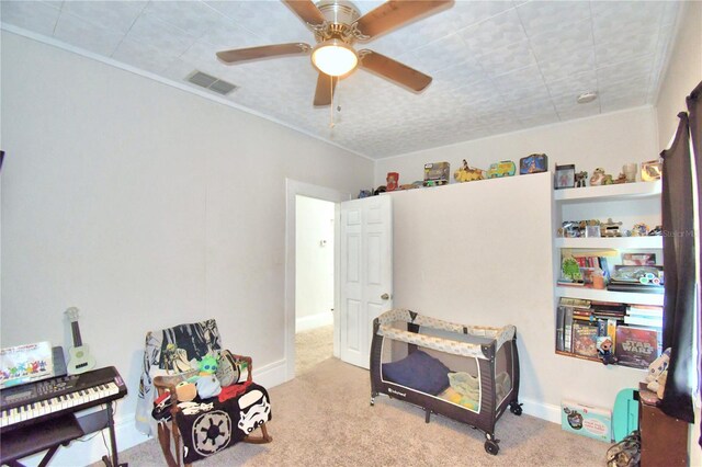 carpeted bedroom featuring ceiling fan