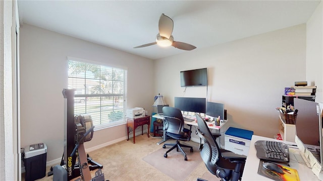 office space featuring ceiling fan and light colored carpet