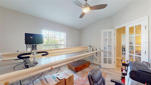 interior space featuring ceiling fan, french doors, light hardwood / wood-style floors, and lofted ceiling