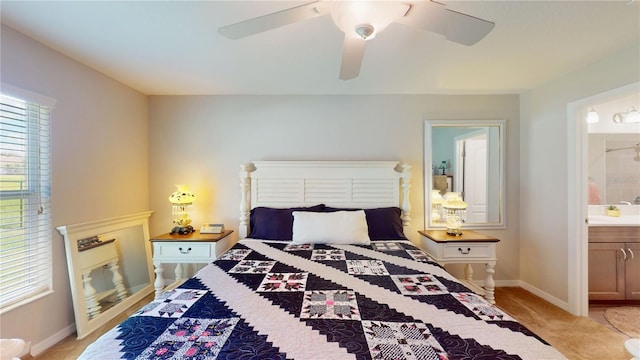 bedroom featuring ceiling fan and ensuite bath