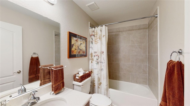 full bathroom with toilet, shower / bath combo with shower curtain, and vanity