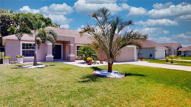 view of front facade featuring a front lawn and a garage