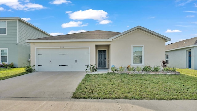 ranch-style home featuring a garage, driveway, a front lawn, and stucco siding