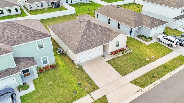 birds eye view of property with a residential view