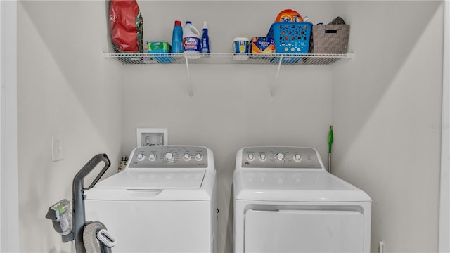 washroom with laundry area and washing machine and dryer