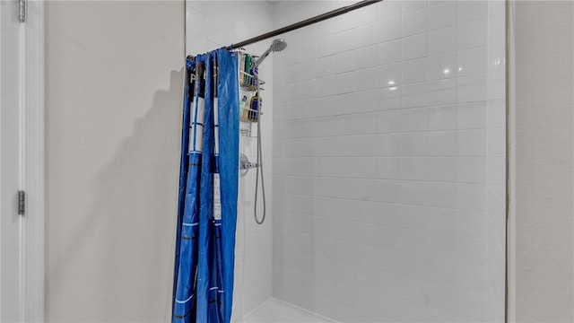 bathroom with a tile shower